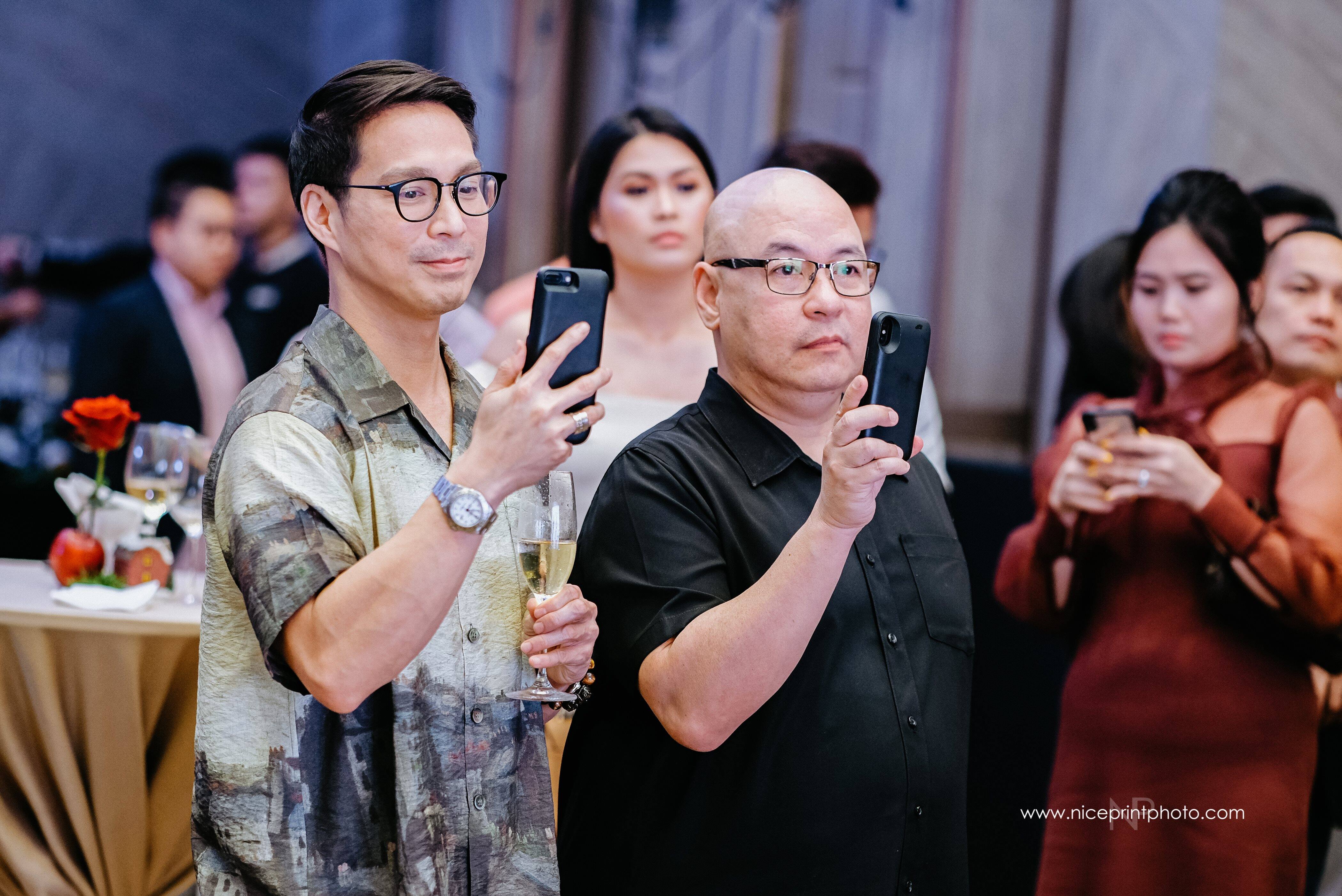 While Christian was giving his speech, his husband Francis and friend Arsi made sure to document the moment. While Christian was giving his speech, his husband Francis and friend Arsi made sure to document the moment.