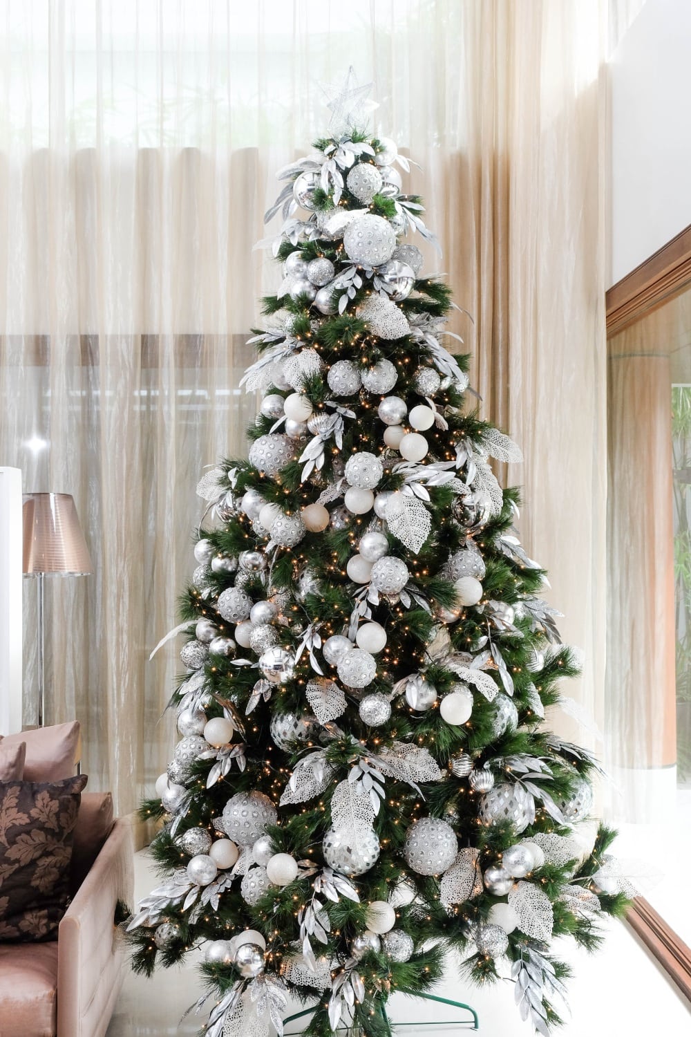 christmas tree decorated with white and silver