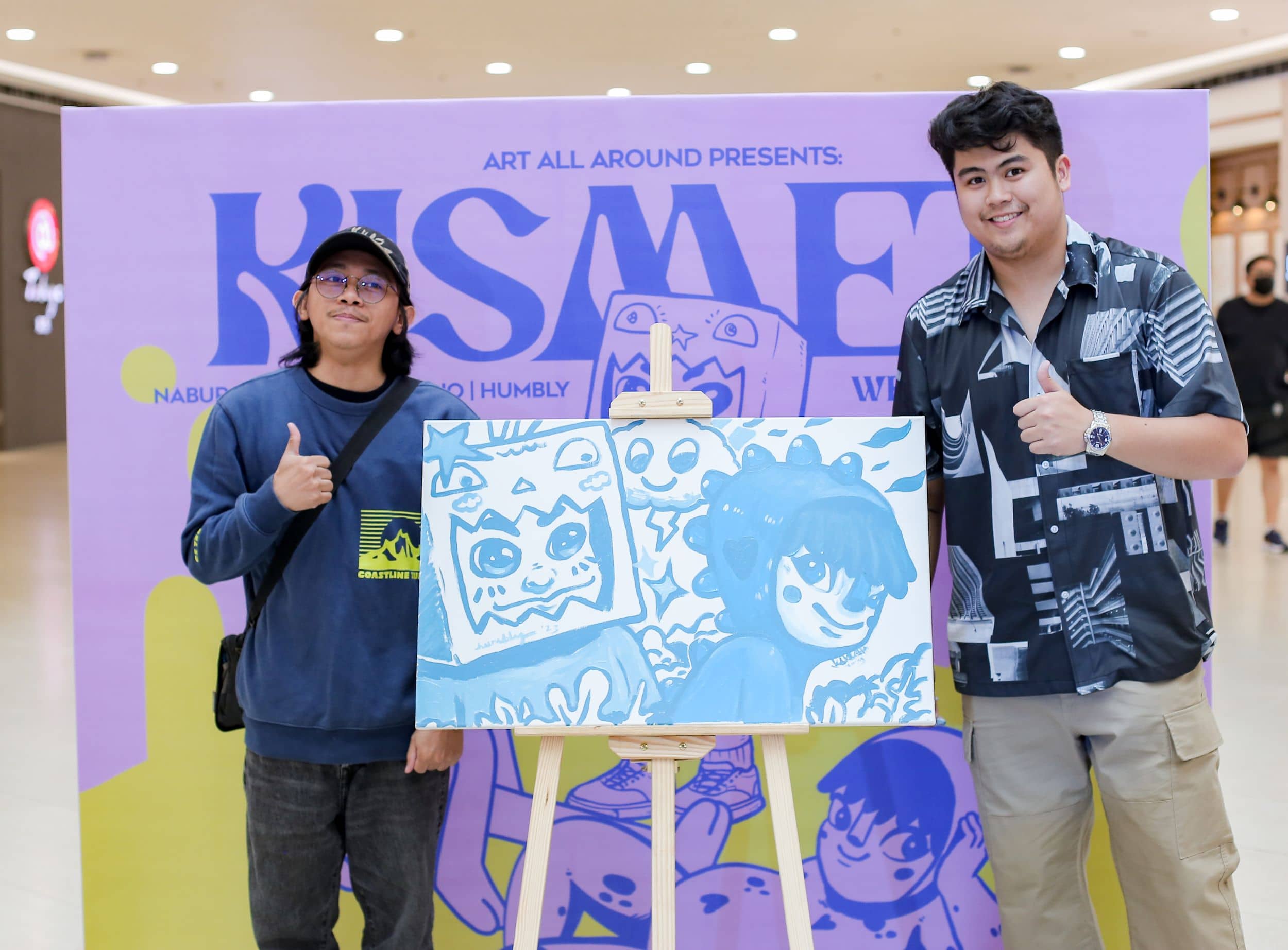 Humbly and Jesse showing the beauty of their interconnected artwork after their live painting collaboration.