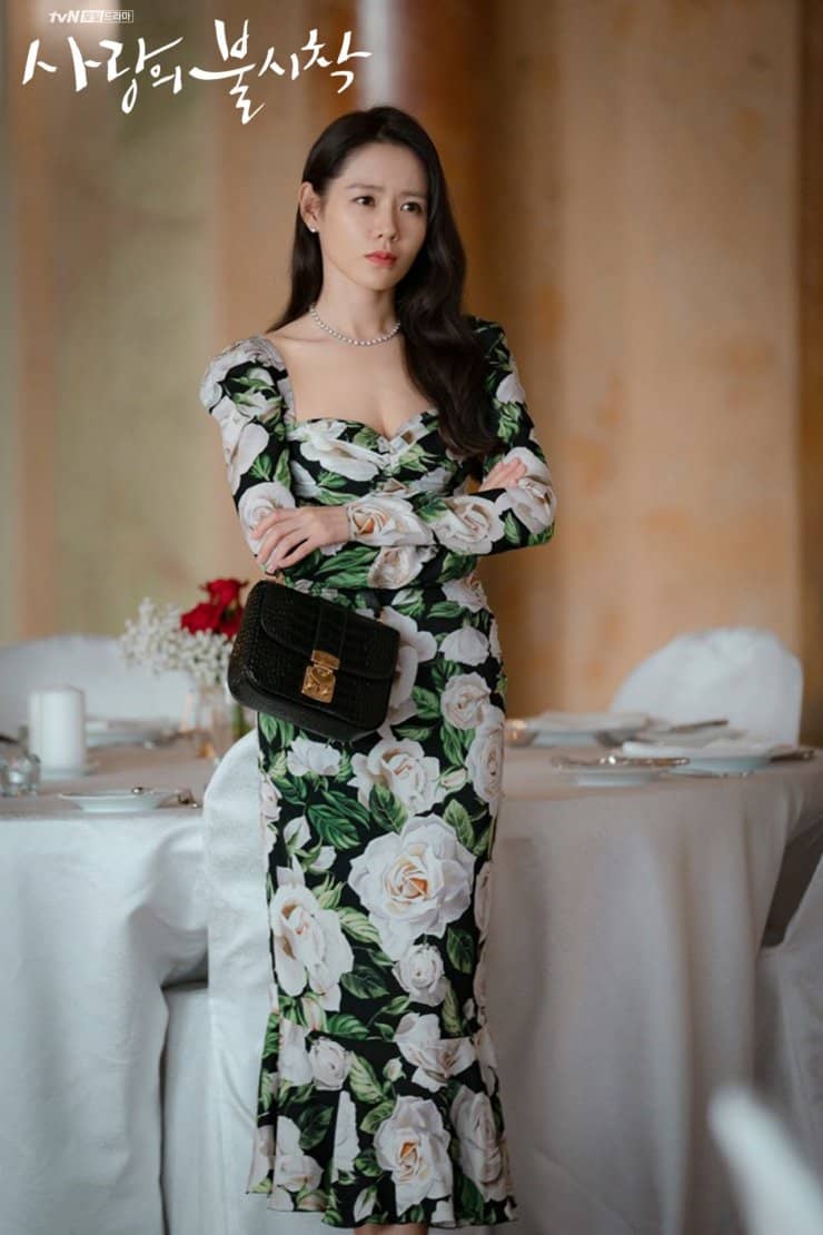 Long and lean in a floral Dolce & Gabbana dress on the set of Crash Landing on You Long and lean in a floral Dolce & Gabbana dress on the set of Crash Landing on You