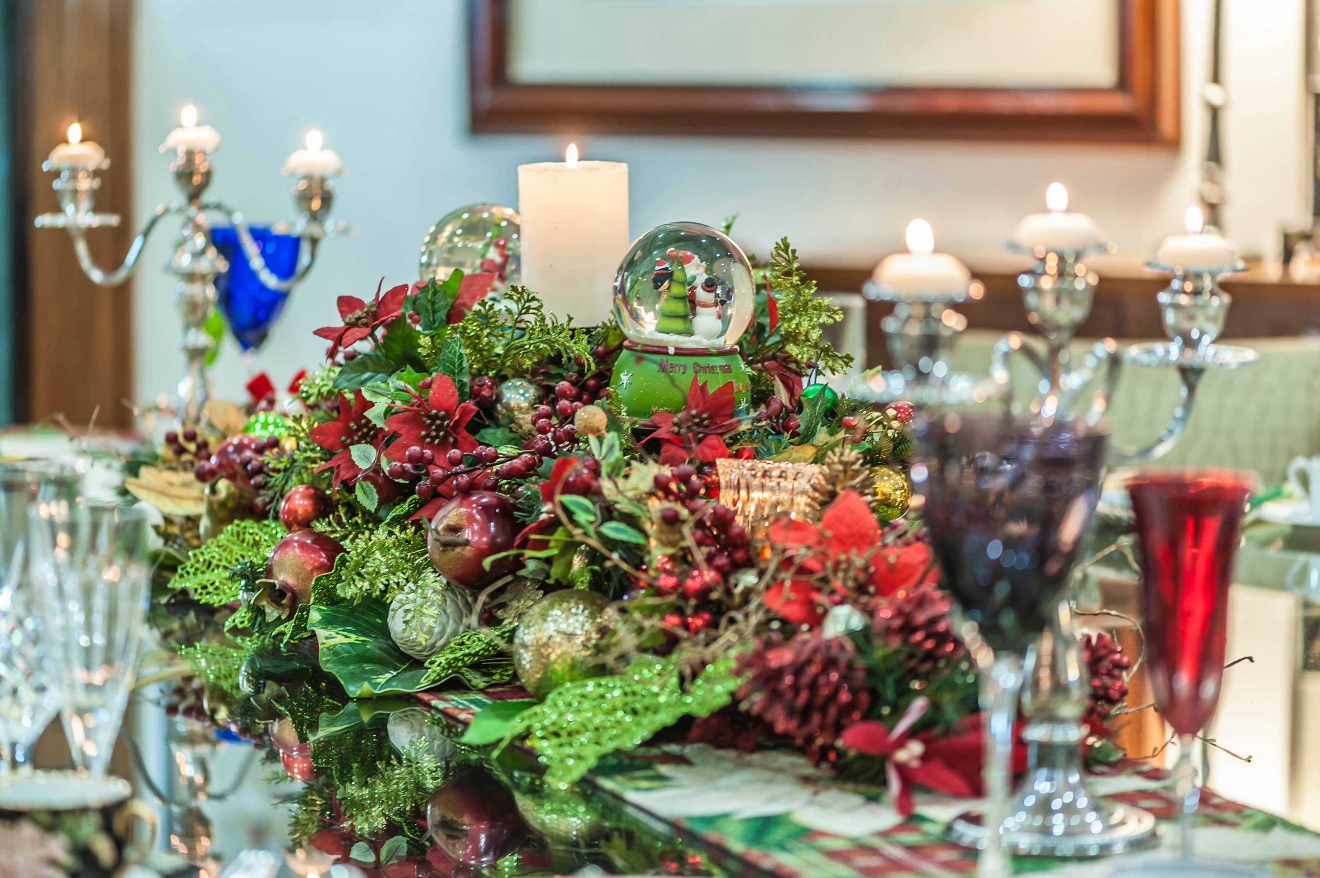 The dining table is all set for a traditional Christmas meal. The dining table is all set for a traditional Christmas meal.