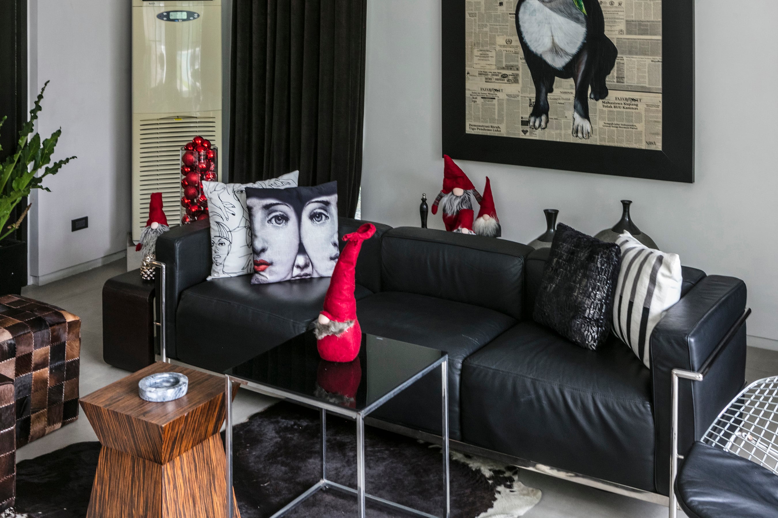 Pops of red make a festive atmosphere in a disciplined palette of black and white in the Alindogan-Zapanta home. Pops of red make a festive atmosphere in a disciplined palette of black and white in the Alindogan-Zapanta home.