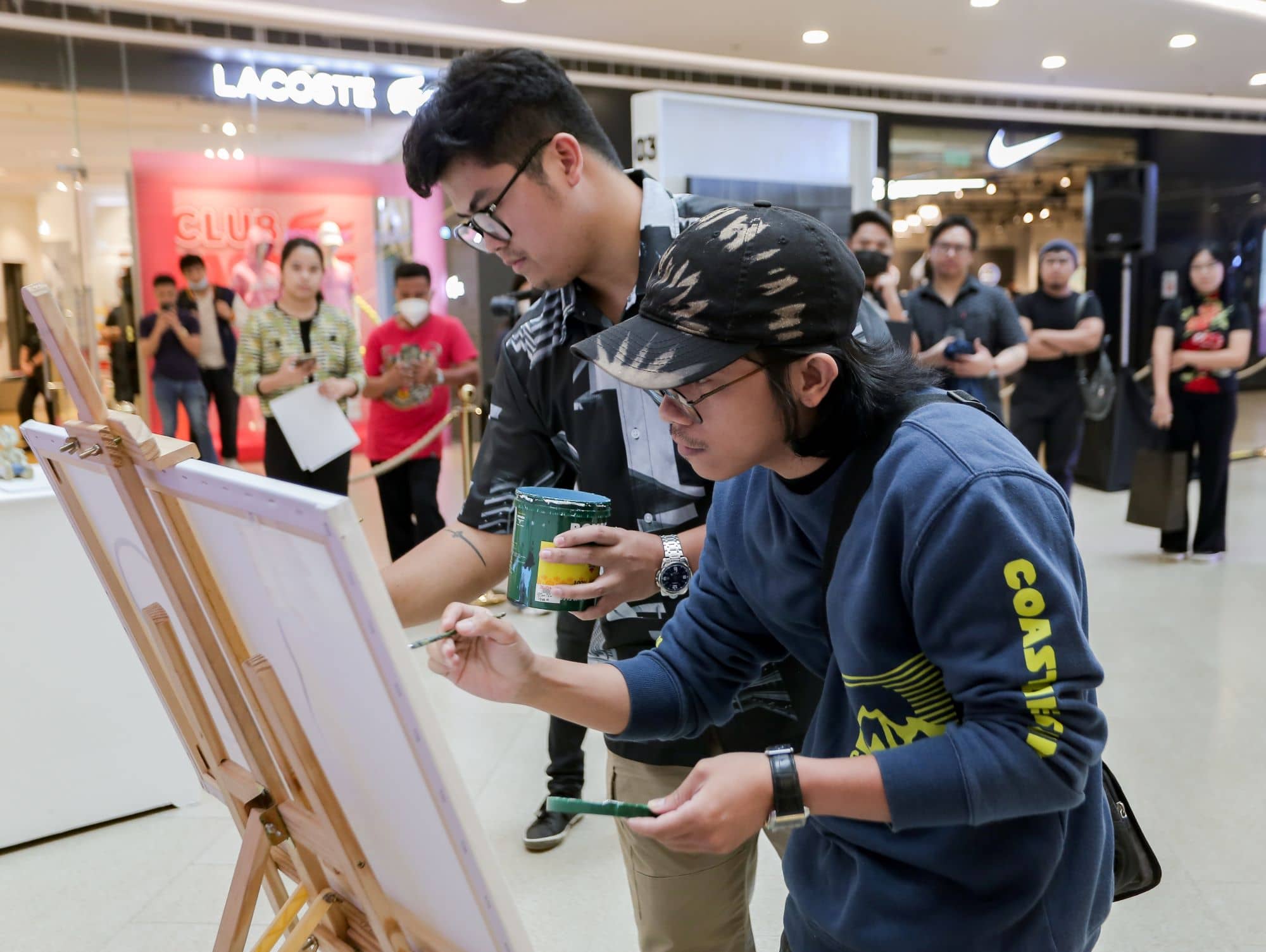 Artists Humbly and Jesse Camacho in a live painting session at the opening day